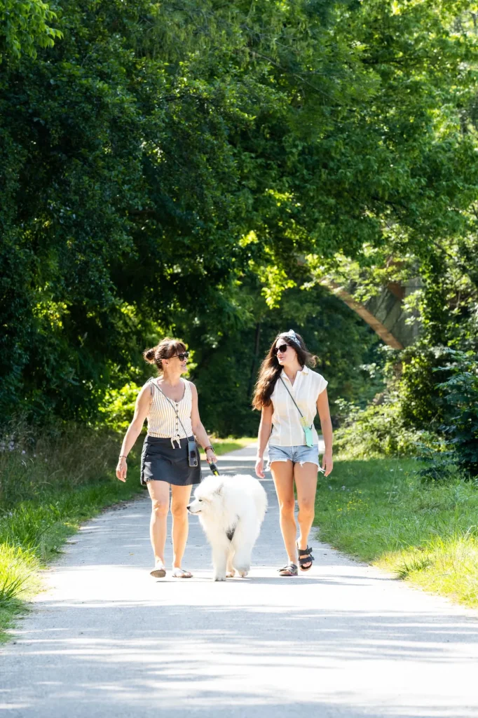 women walking with a dog in lascaux-dordogne